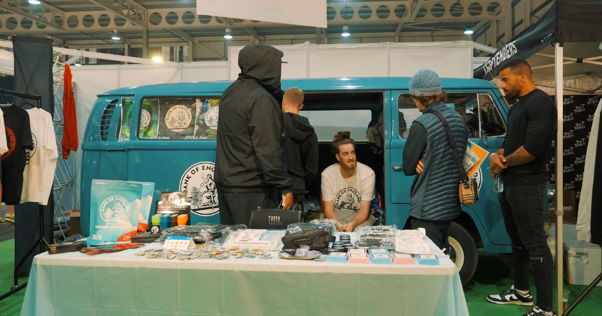 An expo stand with a blue campervan